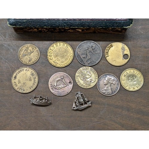 396 - Antique coins/tokens plus 2 x silver ship charms in Edwardian hairpin box