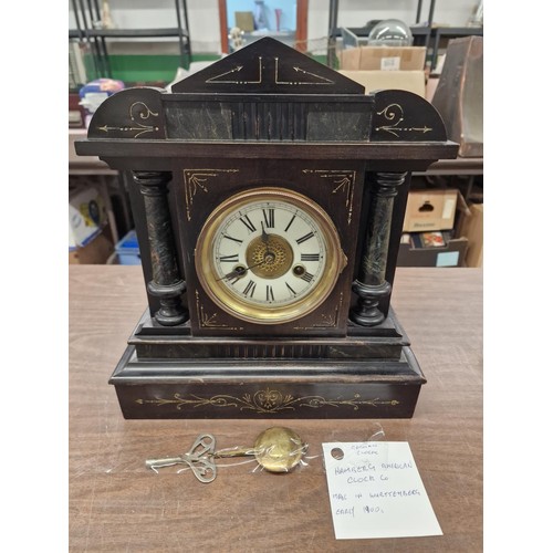 36 - Early 1900s black wooden German mantle clock, key and pendulum present - 13 x 5.5 x 14.5