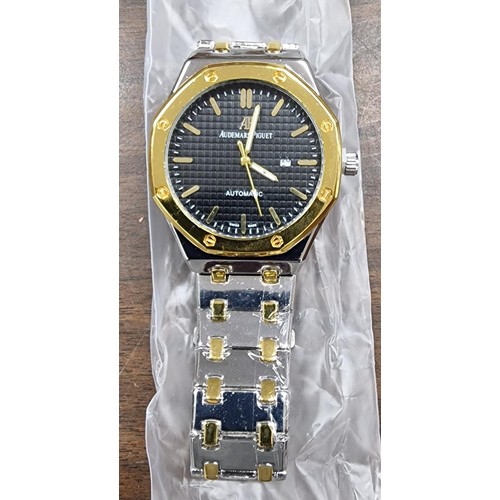 318 - Designer style gold and silver tone watch (new)