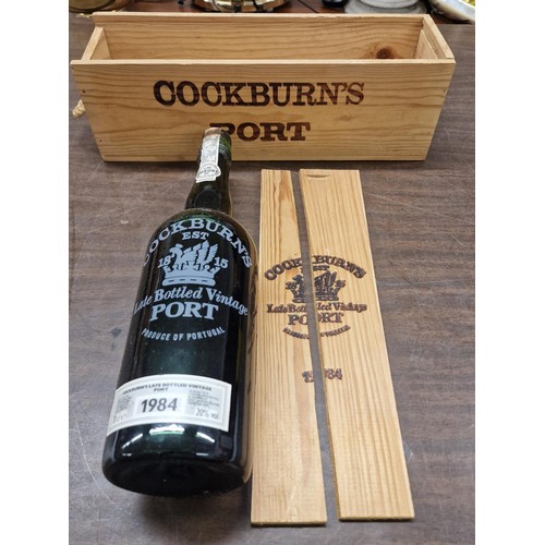 112 - New and unopened wooden boxed Cockburns port 1984 edition-split lid, see picture