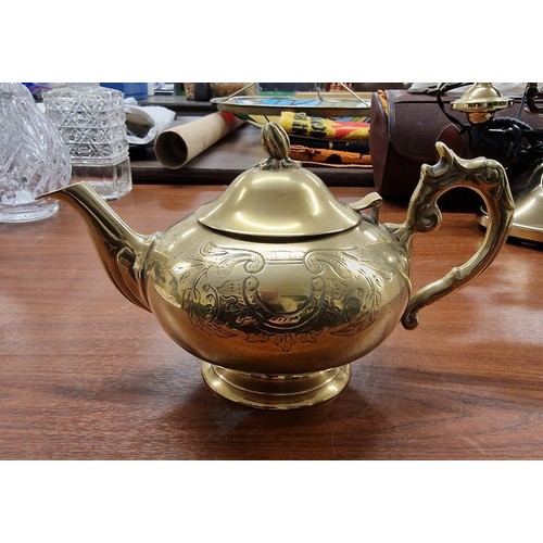 57 - Brass engraved teapot with initials C.T on base