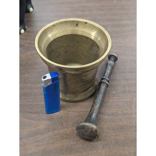 226 - Bronze pestle with 4