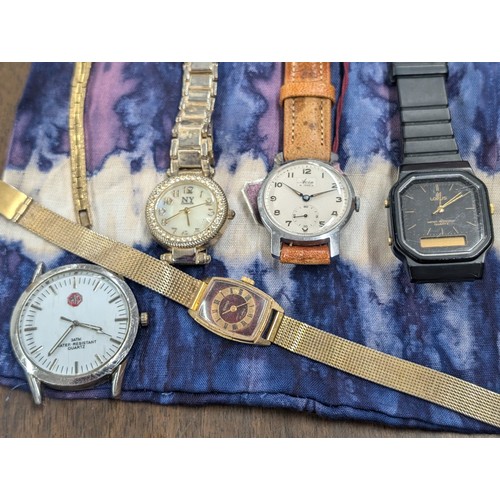 222 - Pouch with assorted wind-up and quartz watches, currently non-working so offered for spare or repair