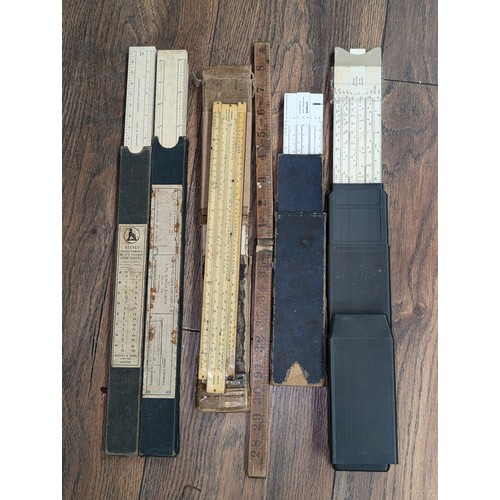 192 - Collection of slide rules and draughtsmen card scales