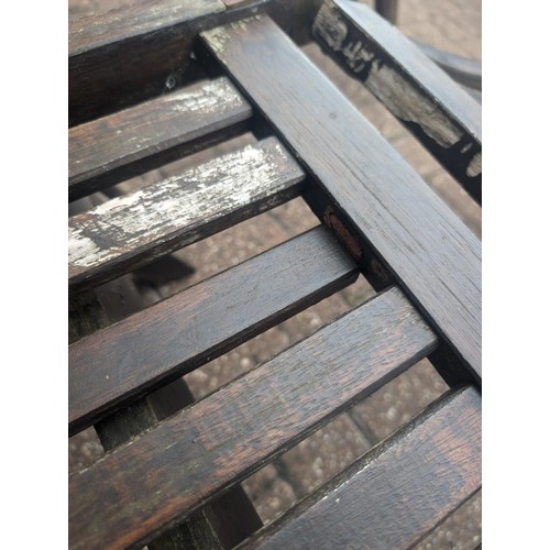 181 - Pair of weathered but sturdy old wooden steamer lounger chairs - 1 with broken seat slat and the oth... 
