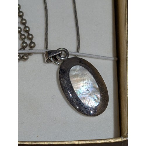 187 - A Les Baker Style Indian Native Reversible Sterling Silver Pendant Necklace, and a Fused Glass Penda... 