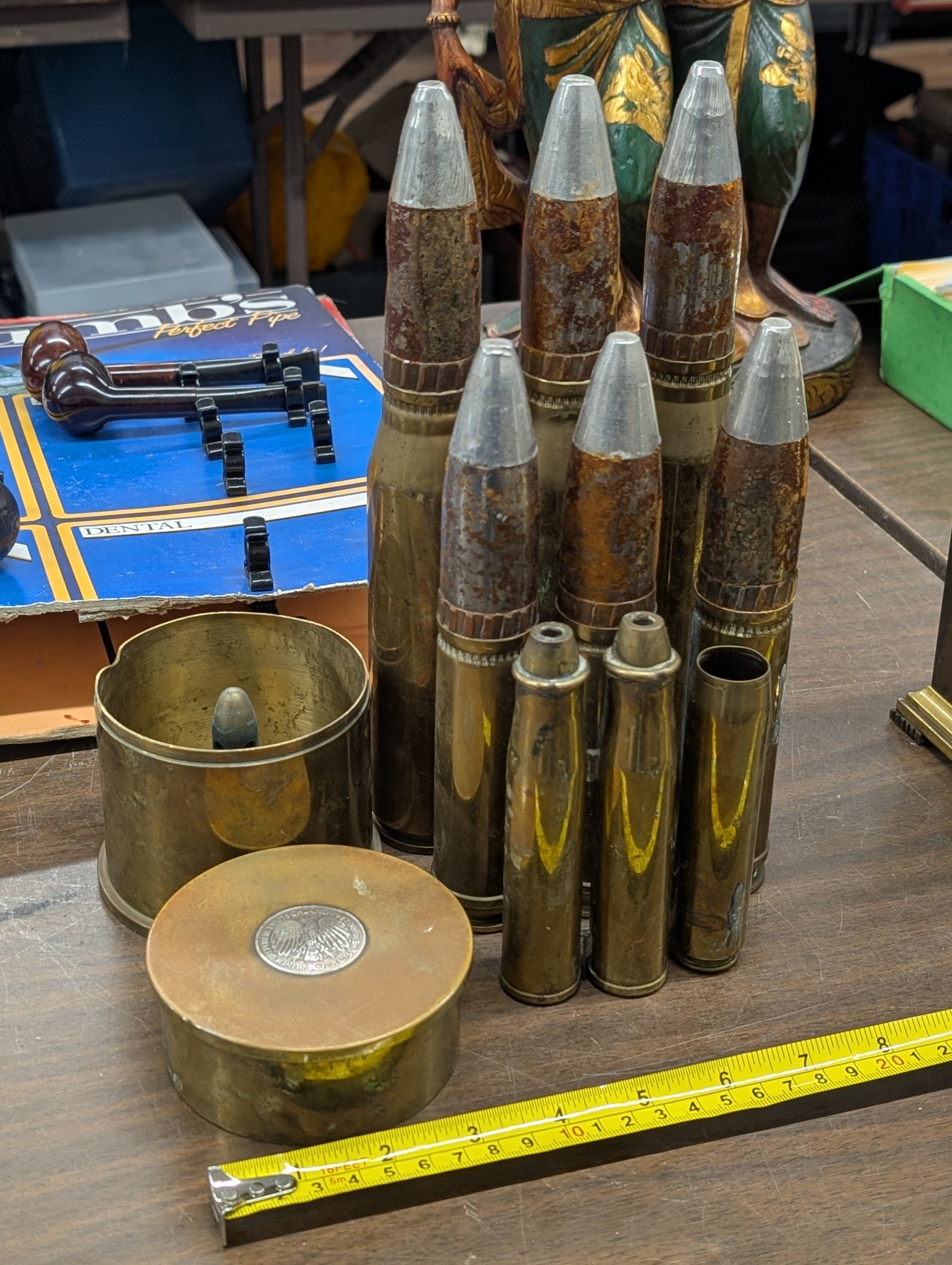 A Collection of Inert Military Ordnance and Spent Brass Artillery Shell ...