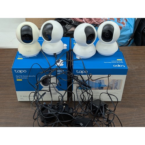 93 - Four Used TP-Link Tapo C200 Pan/Tilt Home Security Wi-Fi Cameras with original packaging