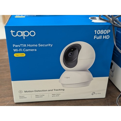 93 - Four Used TP-Link Tapo C200 Pan/Tilt Home Security Wi-Fi Cameras with original packaging