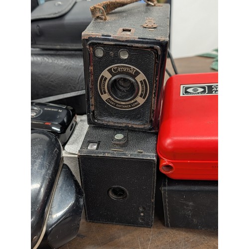 176 - A Collection of Vintage Cameras, Optical Instruments, and Photographic Accessories