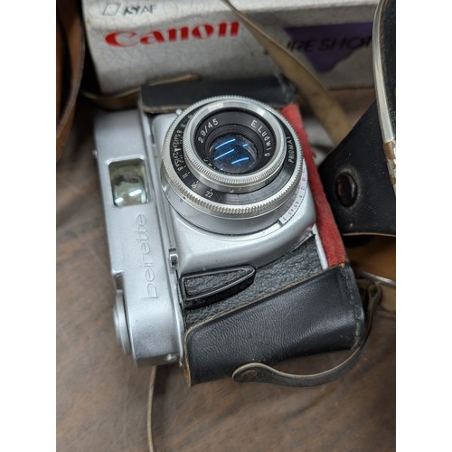 176 - A Collection of Vintage Cameras, Optical Instruments, and Photographic Accessories