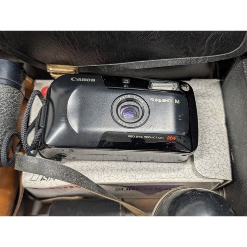 176 - A Collection of Vintage Cameras, Optical Instruments, and Photographic Accessories