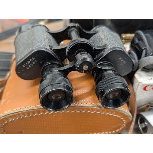 176 - A Collection of Vintage Cameras, Optical Instruments, and Photographic Accessories