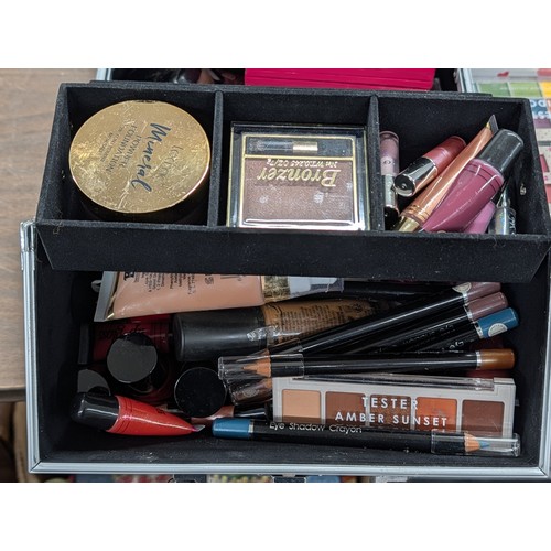 136 - A Professional-Style Makeup Train Case and Mixed Brand Cosmetics