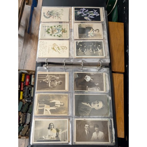 133 - A Large Collection of 200+ Early 20th Century Postcards and Ephemera in a Black Binder