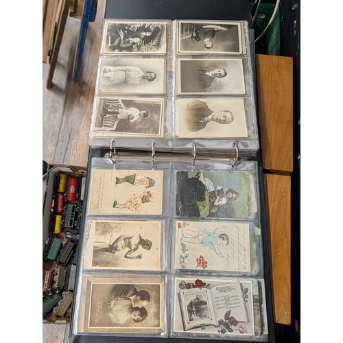 133 - A Large Collection of 200+ Early 20th Century Postcards and Ephemera in a Black Binder