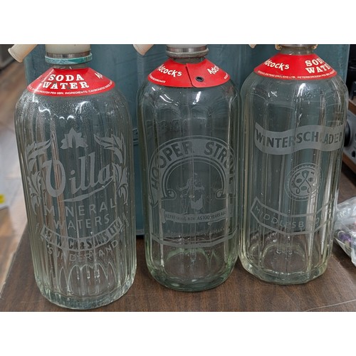 152 - Collection of Six Vintage British Etched Glass Soda Siphons in a Plastic Crate