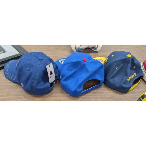 180 - A Trio of New Branded Sports and Lifestyle Baseball Caps Including Champion and Chicago Cubs etc
