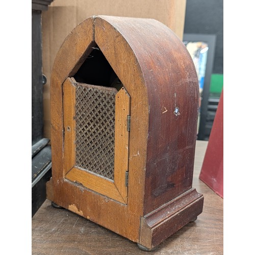 147 - Two Antique Wooden Mantel Clocks including a Junghans Ebonized Architectural Clock and a Gothic Revi... 