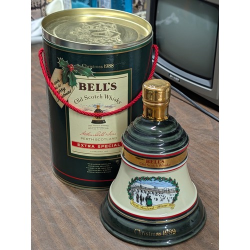 1344 - Unopened Bell's Old Scotch Whisky Christmas 1989 Decanter and 1988 Presentation Canister