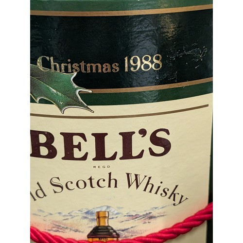 1344 - Unopened Bell's Old Scotch Whisky Christmas 1989 Decanter and 1988 Presentation Canister