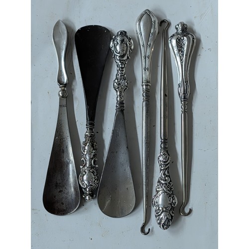 282 - A Collection of Antique British Sterling Silver-Handled Shoehorns and Button Hooks