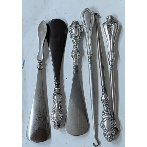 282 - A Collection of Antique British Sterling Silver-Handled Shoehorns and Button Hooks