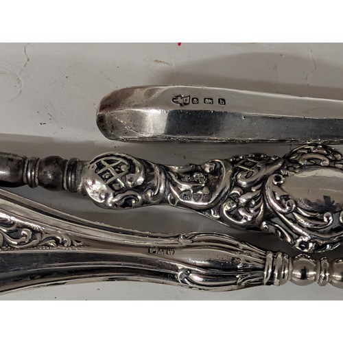 282 - A Collection of Antique British Sterling Silver-Handled Shoehorns and Button Hooks