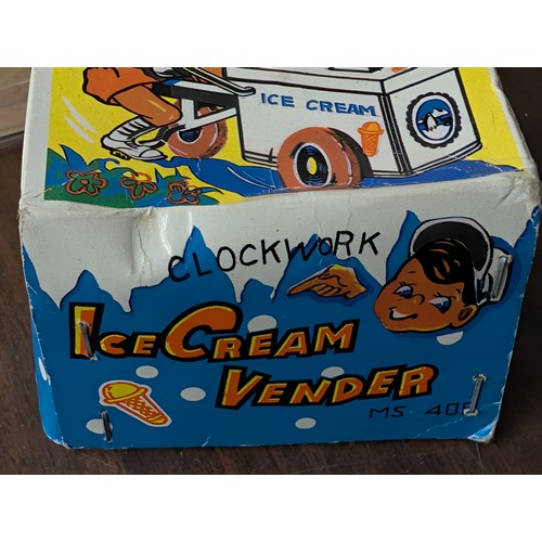 15 - A Pair of Vintage Mechanical Toys comprising an Ice Cream Vender MS 408 and a Jockey Top Gyroscope