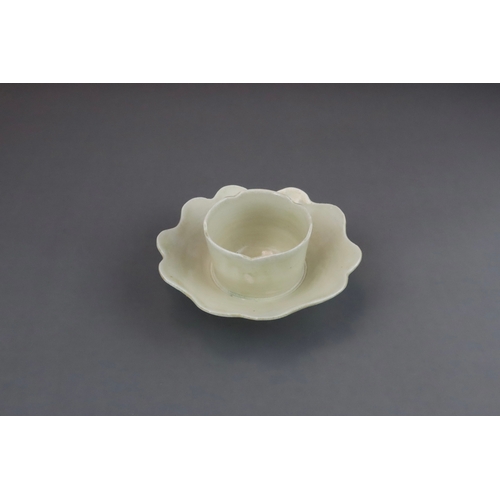 43 - An Extremely Rare Ding-type Lotus-form Cupstand, Five dynasties finely potted, the curved sides of t... 