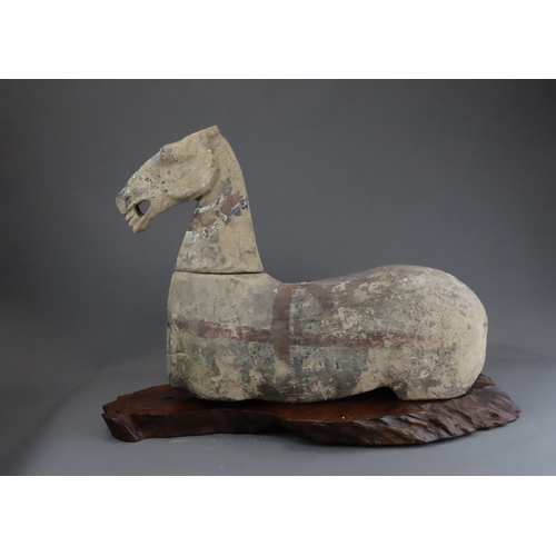 1 - A Painted Pottery Horse with wood stand, Han dynasty modelled recumbent with separate head and apert... 