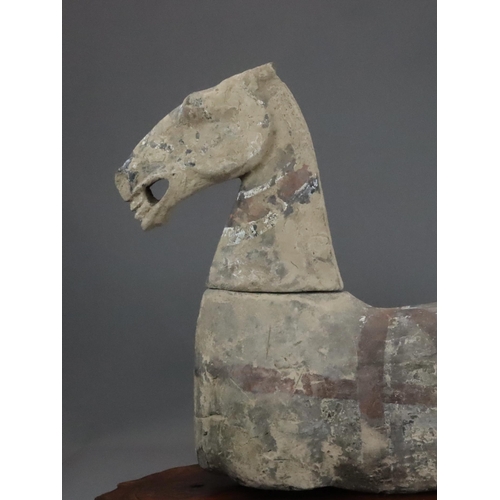 1 - A Painted Pottery Horse with wood stand, Han dynasty modelled recumbent with separate head and apert... 