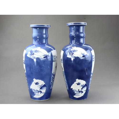 102 - A large Pair of Underglaze Red and Blue decorated Vases, Kangxi, each of tall ovoid form, the should... 