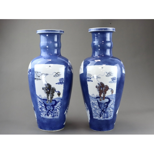 102 - A large Pair of Underglaze Red and Blue decorated Vases, Kangxi, each of tall ovoid form, the should... 