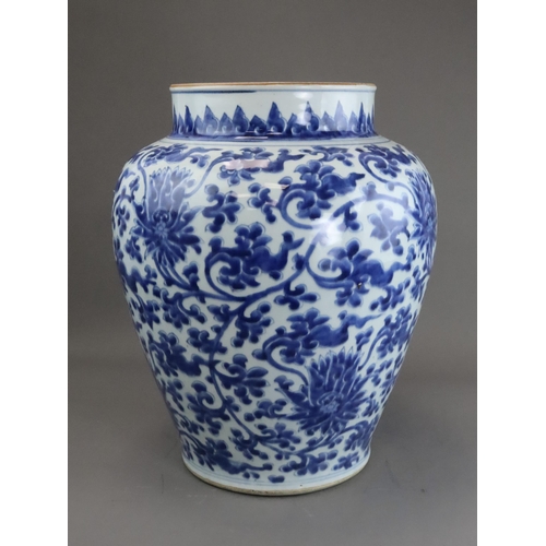 104 - A Blue and White Lotus Scroll Jar, Kangxi, the baluster sides sides well painted in rich soft blue w... 