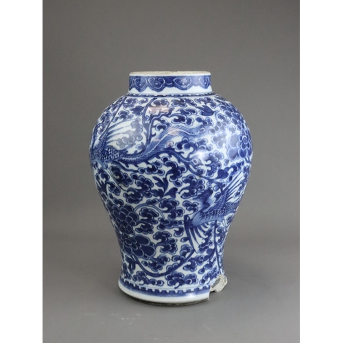 105 - A Blue and White Phoenix and Peony Vase, Kangxi of baluster shape,  painted to the sides in a contin... 