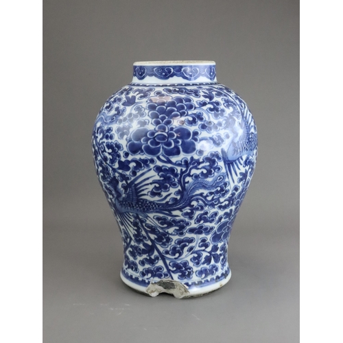 105 - A Blue and White Phoenix and Peony Vase, Kangxi of baluster shape,  painted to the sides in a contin... 