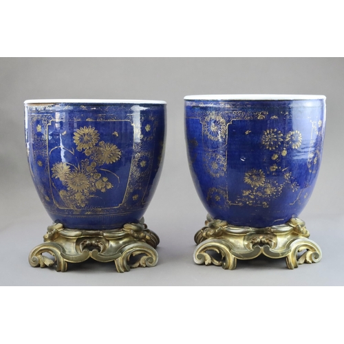 106 - An Attractive Gilt decorated Pair of 'bleu souffle' Jardinieres, Kangxi, later mounted in French orm... 