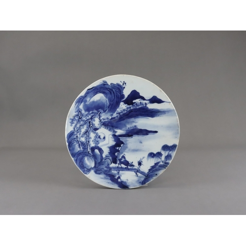 112 - A Blue and White Landscape Roundel, 19th century, well painted in inky tones of blue, with a misty m... 