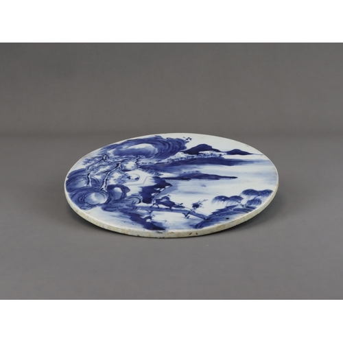 112 - A Blue and White Landscape Roundel, 19th century, well painted in inky tones of blue, with a misty m... 