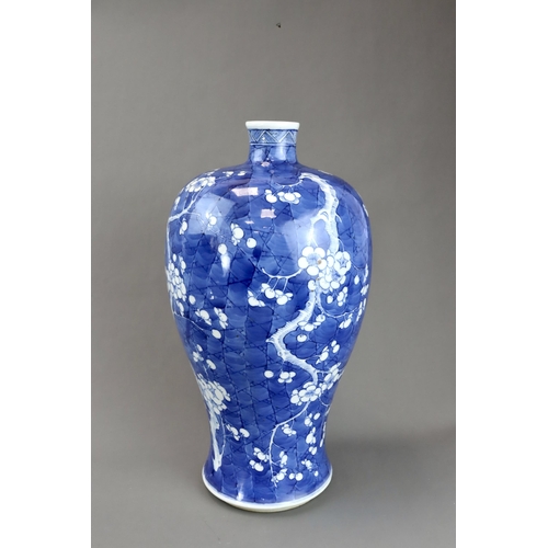 120 - A Blue and White Vase with Prunus, 19th century the rounded shoulders swelling then tapering towards... 