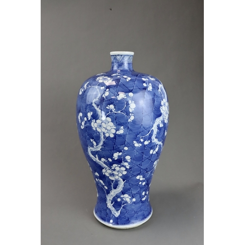 120 - A Blue and White Vase with Prunus, 19th century the rounded shoulders swelling then tapering towards... 