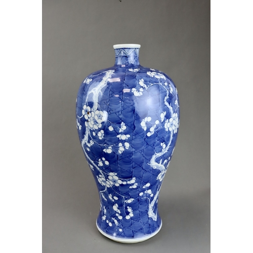 120 - A Blue and White Vase with Prunus, 19th century the rounded shoulders swelling then tapering towards... 