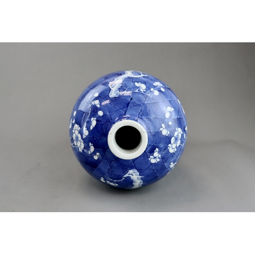 120 - A Blue and White Vase with Prunus, 19th century the rounded shoulders swelling then tapering towards... 