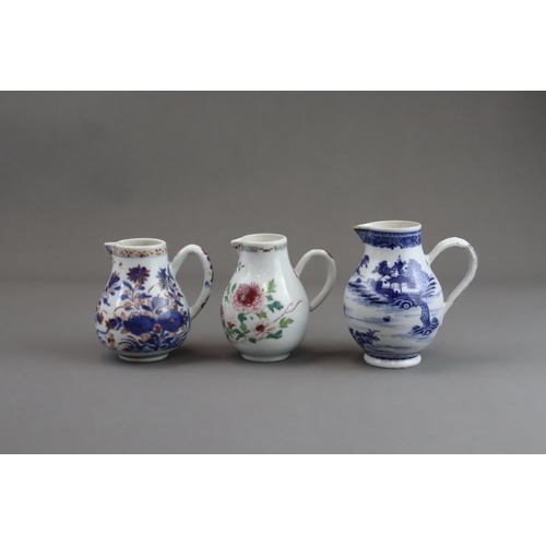 122 - Three Blue and White and 'famille rose' Milk Jugs, 18th century of pear shape with handle, two paint... 