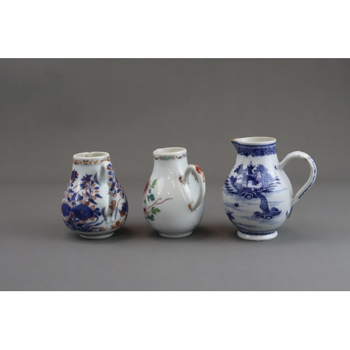 122 - Three Blue and White and 'famille rose' Milk Jugs, 18th century of pear shape with handle, two paint... 