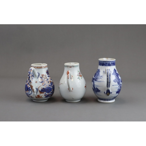 122 - Three Blue and White and 'famille rose' Milk Jugs, 18th century of pear shape with handle, two paint... 