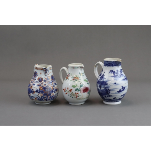 122 - Three Blue and White and 'famille rose' Milk Jugs, 18th century of pear shape with handle, two paint... 