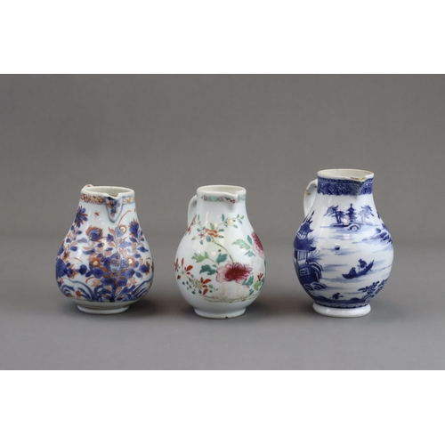 122 - Three Blue and White and 'famille rose' Milk Jugs, 18th century of pear shape with handle, two paint... 