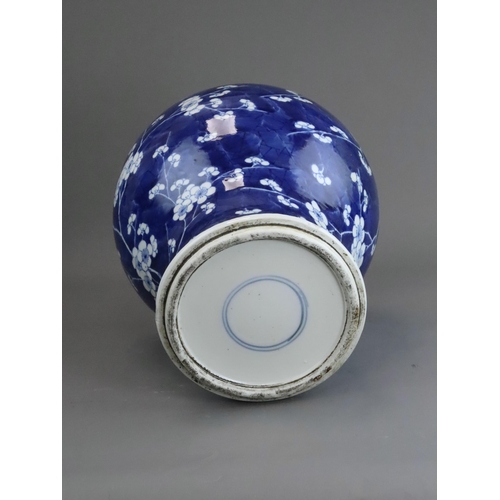 127 - A Blue and White Baluster Vase with Prunus, Kangxi the sides painted in deep tones with pendent flow... 